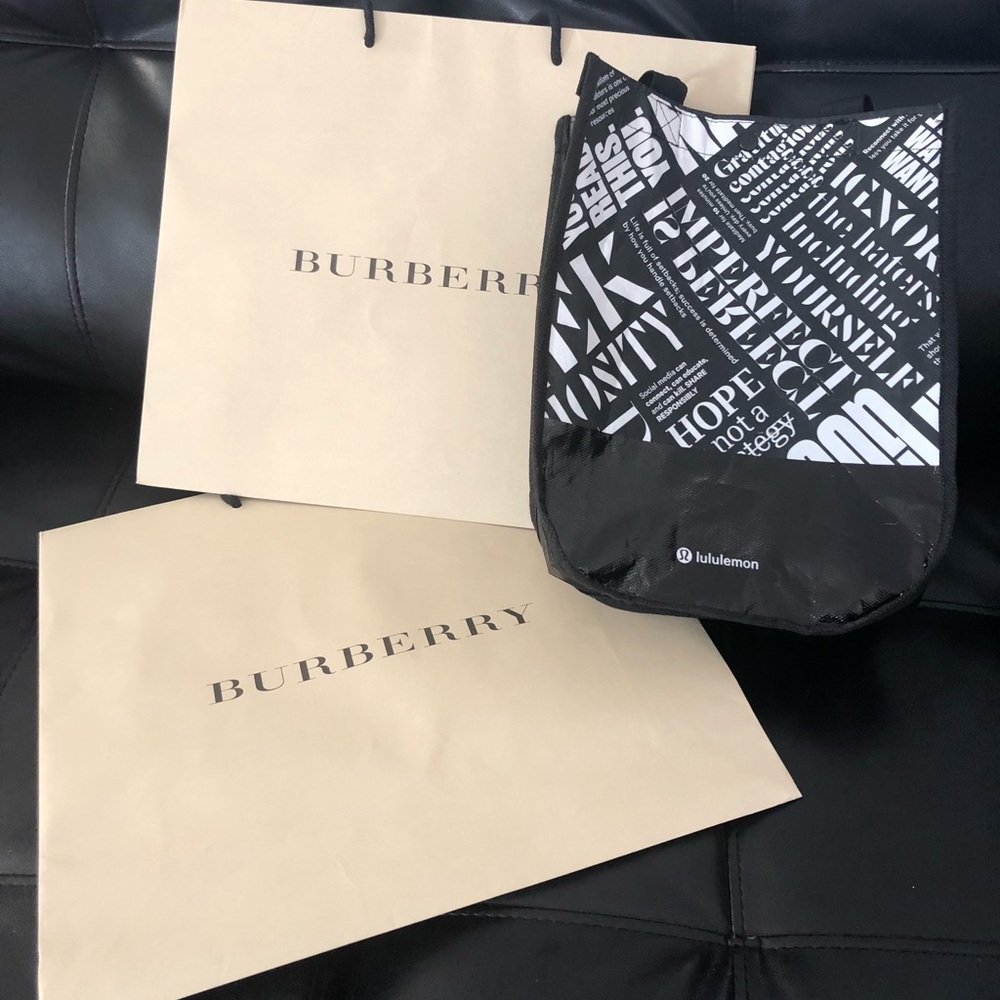 2 Burberry and 1 Lululemon shopping bags